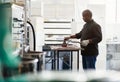 Artisanal chocolate maker working at a factory table