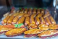 Artisanal marzipan figures. Hot dog, sandwiches, carrots, bread with chocolate marzipan shapes for dessert.