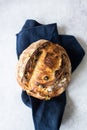 Artisanal sourdough bread with olives on a napkin