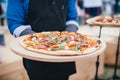 artisanal woodfired pizzas crafted at a food festival Royalty Free Stock Photo