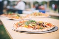 artisanal woodfired pizzas crafted at a food festival Royalty Free Stock Photo