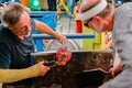 Artisans creating and shaping glass bowls and dishes