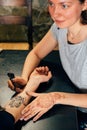 Artist applying henna mehndi tattoo on female hand Royalty Free Stock Photo