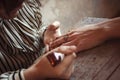 Artist applying henna tattoo on women hands Royalty Free Stock Photo