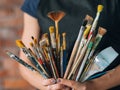 Artist art supplies tools woman paintbrushes bunch Royalty Free Stock Photo