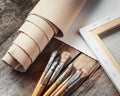 Artist canvas in roll, canvas stretcher and paintbrushes Royalty Free Stock Photo