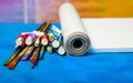 Artist canvas in roll, canvas stretcher and paintbrushes . Royalty Free Stock Photo