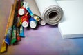 Artist canvas in roll, canvas stretcher and paintbrushes Royalty Free Stock Photo