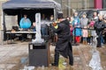 An artist carves ice with a chainsaw in a demonstration at the Fire and Ice Festival in Durham UK