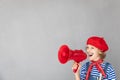 Artist child speaking by loudspeaker Royalty Free Stock Photo