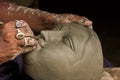 Artist creates the head of a goddess