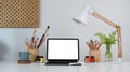 Artist or creative designer workplace with tablet and drawing equipment on white table. Royalty Free Stock Photo