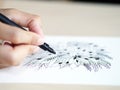 Artist desk top view pen, pencil mandala flower floral hand drawing