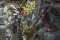 Artist doing a fine colour job on a Clay idols of hindu godess at Kumartuli Workshop,Kolkata,India