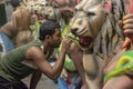 Artist doing a fine colour retouching job on a Clay idols of hindu godess at Kumartuli Workshop,Kolkata,India