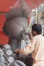 Artist Doing a fine retouching job ona a Clay idols of hindu godess at Kumartuli,Kolkata,India