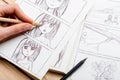 Artist drawing an anime comic book in a studio Royalty Free Stock Photo