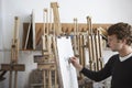 Artist Drawing Charcoal Portrait In Studio