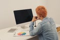 An artist drawing something on graphic tablet at the office Royalty Free Stock Photo