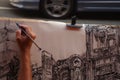 Artist draws a glimpse of the city with a pencil