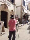 The artist draws a picture of the street in the port city of Azueira Morocco Africa.