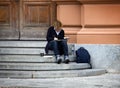 The artist draws sitting on the steps Royalty Free Stock Photo