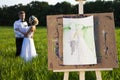 Artist easel outdoors and the couple