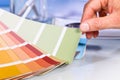 Artist hand browsing color samples in palette Royalty Free Stock Photo