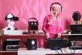 Artist with headphones playing electronic song at professional turntables Royalty Free Stock Photo