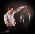 Artist hold big soap bubble in his hands. Royalty Free Stock Photo