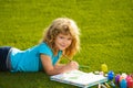 Artist kids. Child boy enjoying art and craft drawing in backyard or spring park. Children drawing draw with pencils