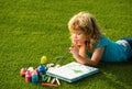 Artist kids. Schooler kids drawing in summer park, painting art. Little painter draw pictures outdoor.