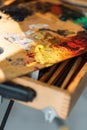 artist mess painting tools oil paint on palette Royalty Free Stock Photo