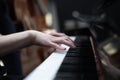 Playing the piano on a black background