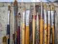 Artist paint brush set. Flat lay of many artist tools in calico paint brush holder