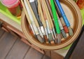 Artist paint brushes closeup on plate Royalty Free Stock Photo
