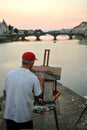 Artist painting the bridges of Florence city , Italy