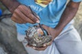 Artist painting inside seashell