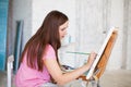 Artist painting picture on canvas whith watercolours Royalty Free Stock Photo