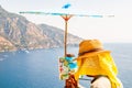 The artist painting scenery of a beautiful Positano city coast scenic rocky surroundings on one of a cliffs with blue sea waters