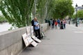 Artist painting by the seine river