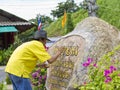 Artist painting sign at Big Buddha Statue site. Royalty Free Stock Photo