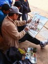 An artist painting watercolor in Patan Durbar Square in Nepal