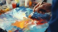 Artist paints a picture of oil paints. Hand of artist holding a brush. Hand painting concept Royalty Free Stock Photo