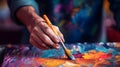 Artist paints a picture of oil paints. Hand of artist holding a brush. Hand painting concept Royalty Free Stock Photo