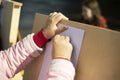 Artist paints on street. Hand holds pencil. Fine Arts . Woman`s hands and malbert Royalty Free Stock Photo