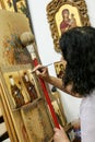 Artist paiting icons in icon painting studio in Kalabaka, Greece Royalty Free Stock Photo