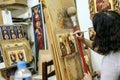 Artist paiting icons in icon painting studio in Kalabaka, Greece Royalty Free Stock Photo