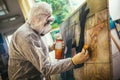 The artist restores the painting