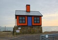 Tiny orange house art installation. Folkestone, Kent, UK